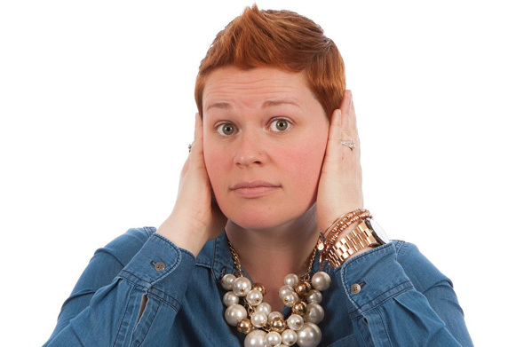 lady with hands over ears