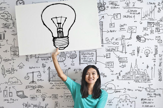 lady holding up a lightbulb